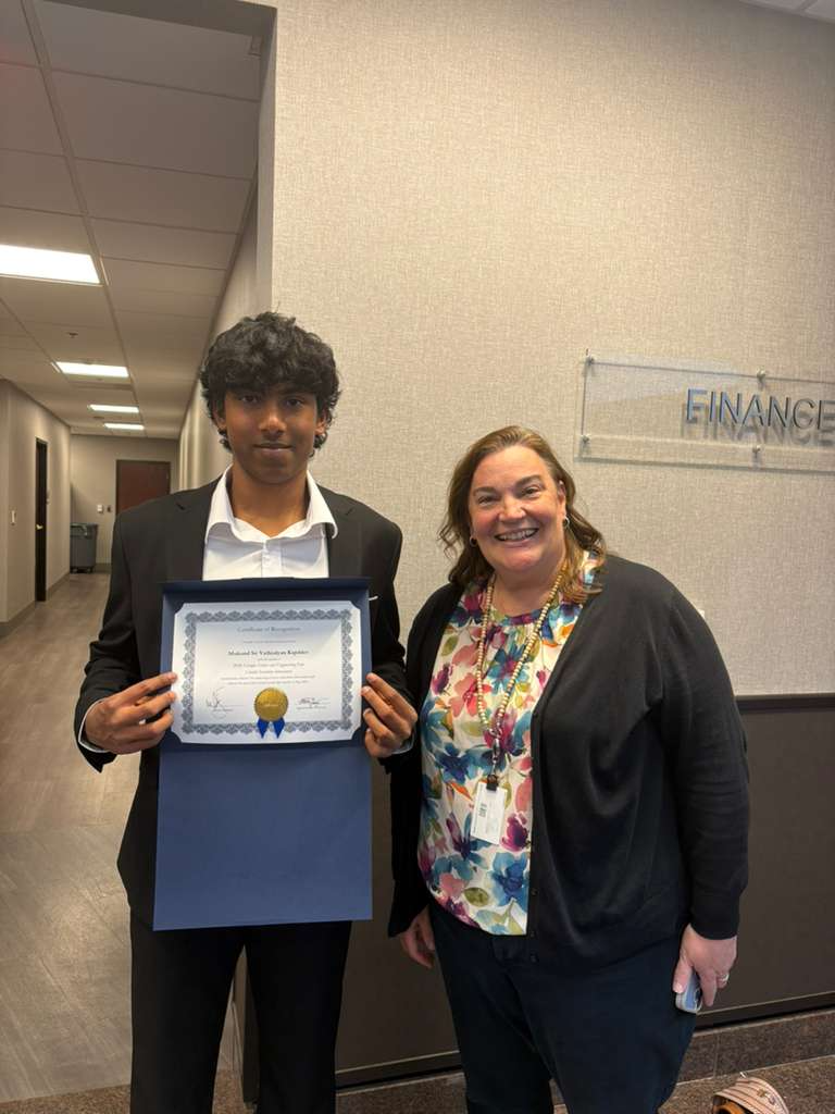 Student standing proudly at World Technocon
